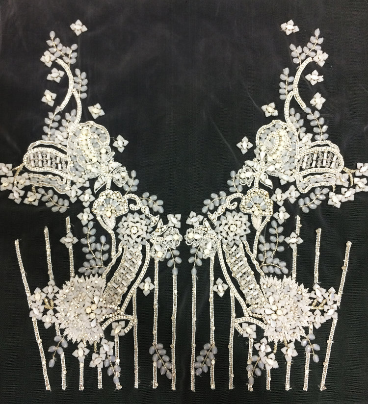 Customised hand embroidery for a couture bridal gown customized to the bodice pattern