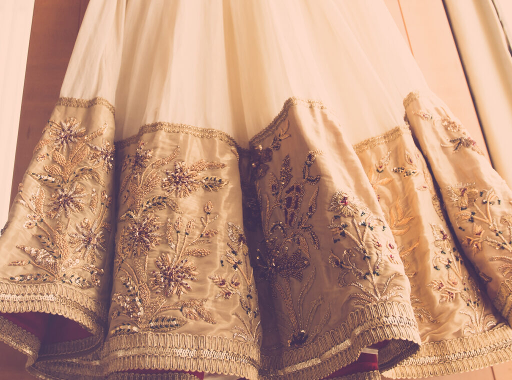 Hand embroidered bridal-wear with stones, sequins, gold thread by Ricamour
