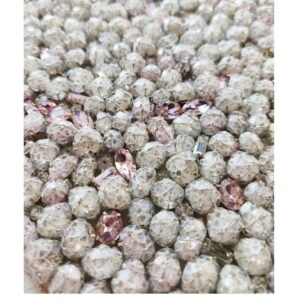 Crystals covered with cupped sequins and silver thread to make a couture crystal embellishment for a bag, shoe or gown