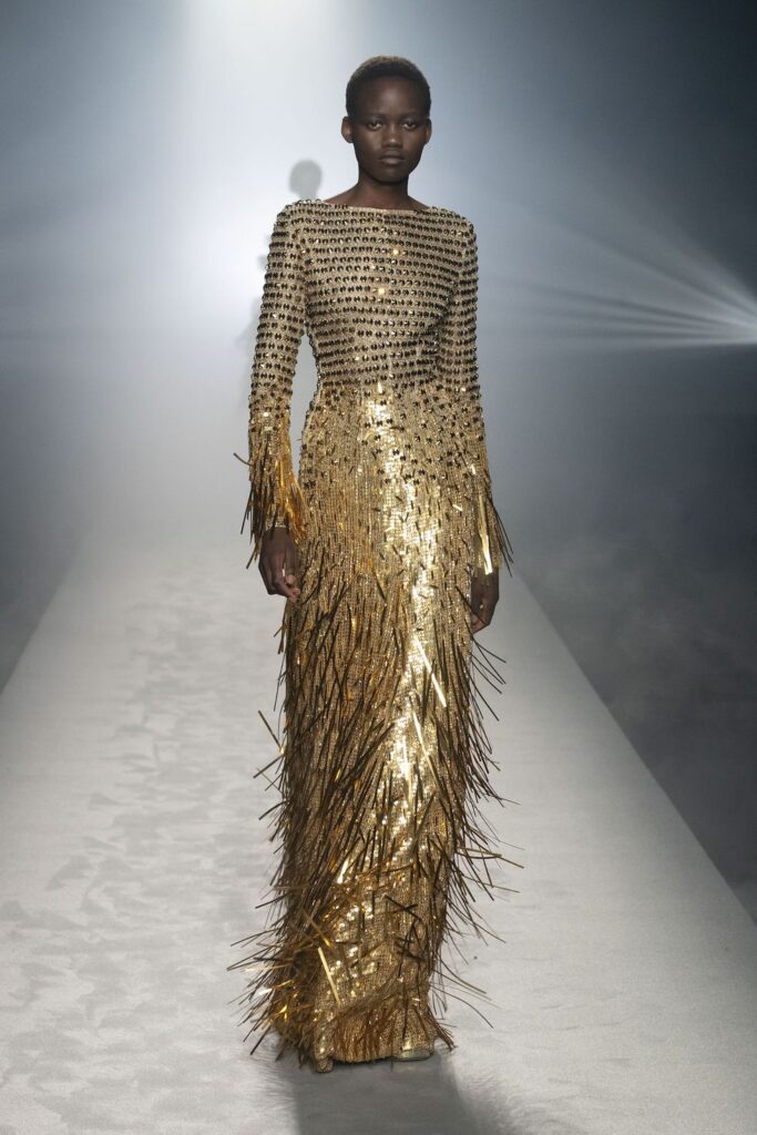 Alberta Ferretti’s dramatic and sparkly golden outfit