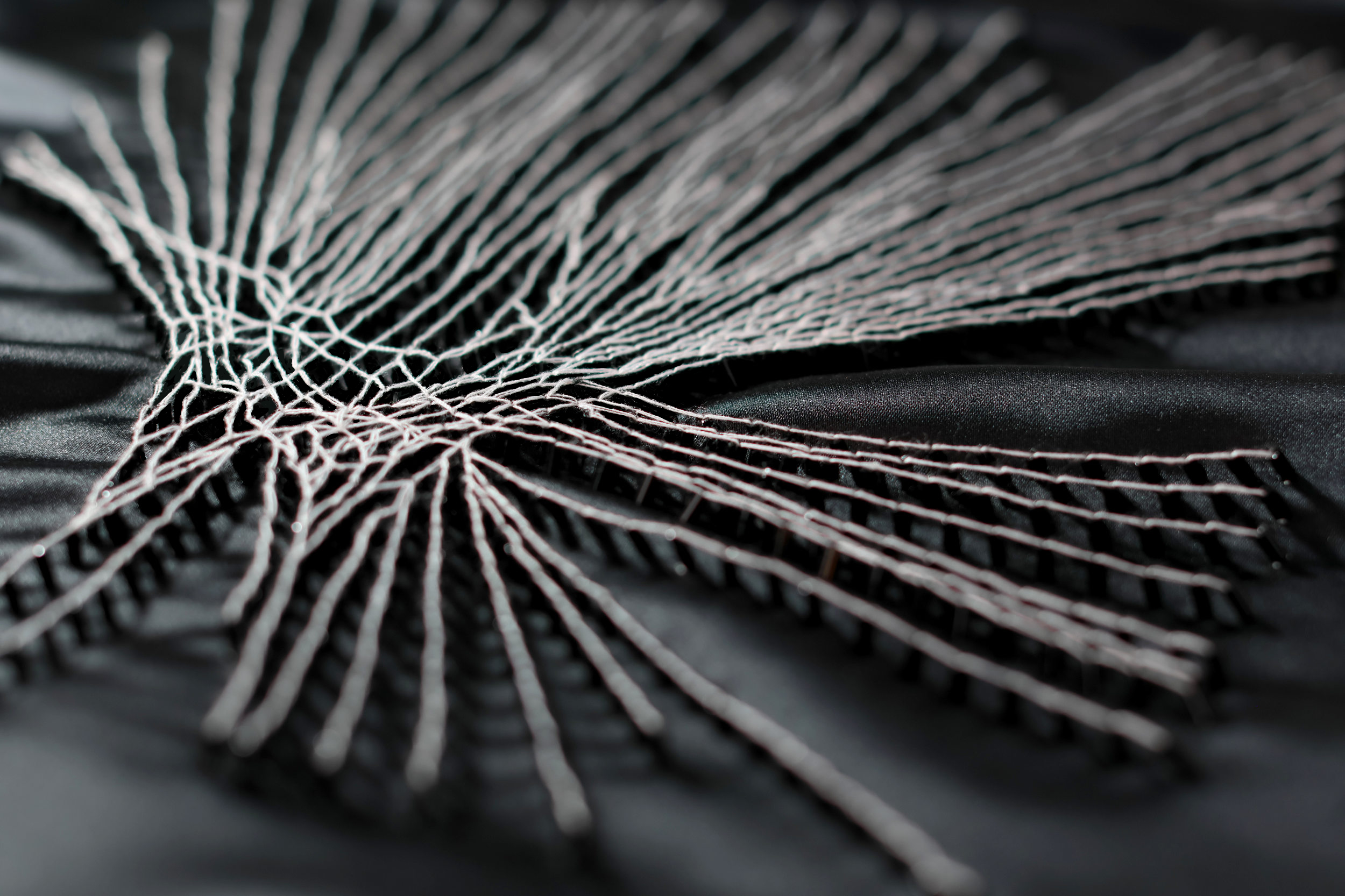 Hand embroidered spiderweb for couture and art by Ricamour