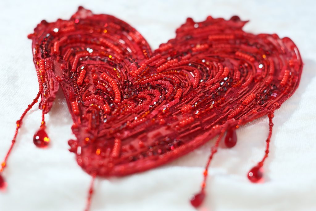 A stunning hand-embroidered heart with crystals hanging