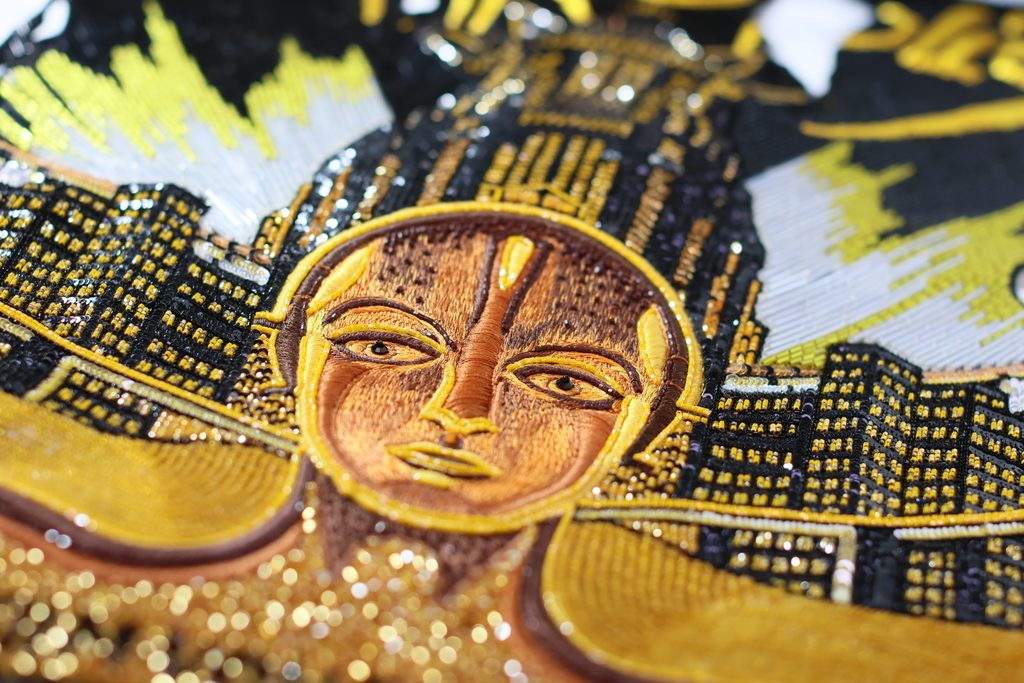 Hand-embroidered movie poster crafted by Ricamour